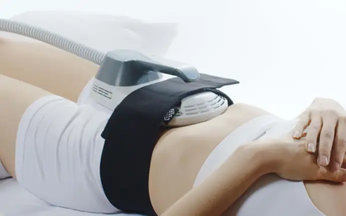 Person undergoing a non-invasive body contouring treatment with a specialized device, administered by a Sexual Health Expert in Los Angeles.