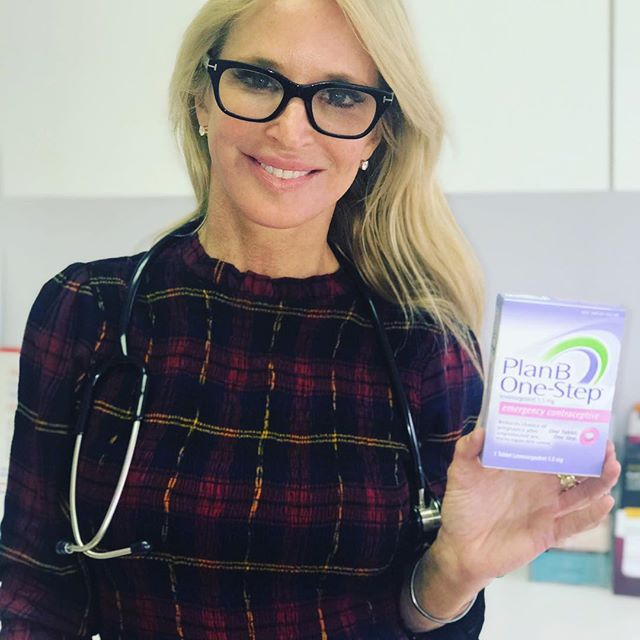 A smiling sexual health specialist in glasses, holding a box of plan b one-step emergency contraception.