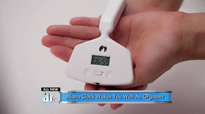 A hand holding a unique alarm clock with a digital display showing the time, accompanied by a caption that reads, "Wake up refreshed: Discover how hormone therapy from a Los Angeles sexual health specialist enhances your
