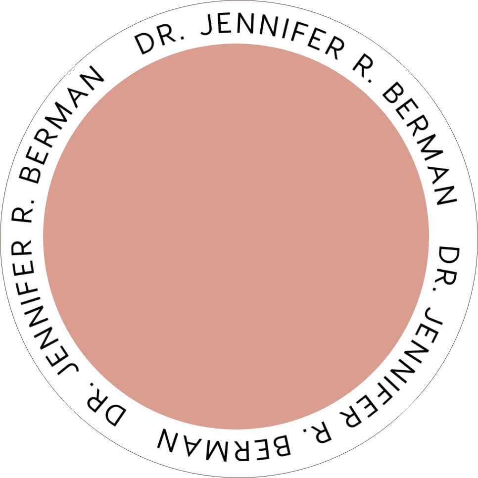 The image appears to be a simplified representation or icon of a circular object, possibly to symbolize a button or a minimalistic design. The central part is a solid, peach-colored circle with a thick
