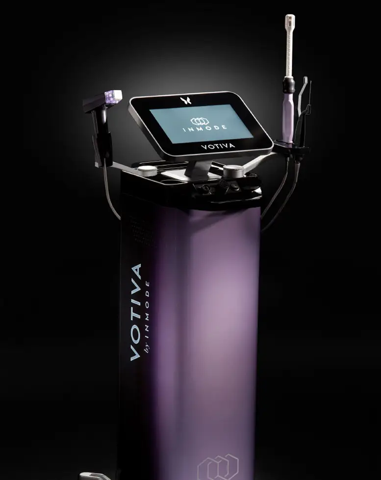 A sleek and modern medical device with a touchscreen display and various instruments attached, designed by a Sexual Health Expert in Los Angeles, stands against a dark background.