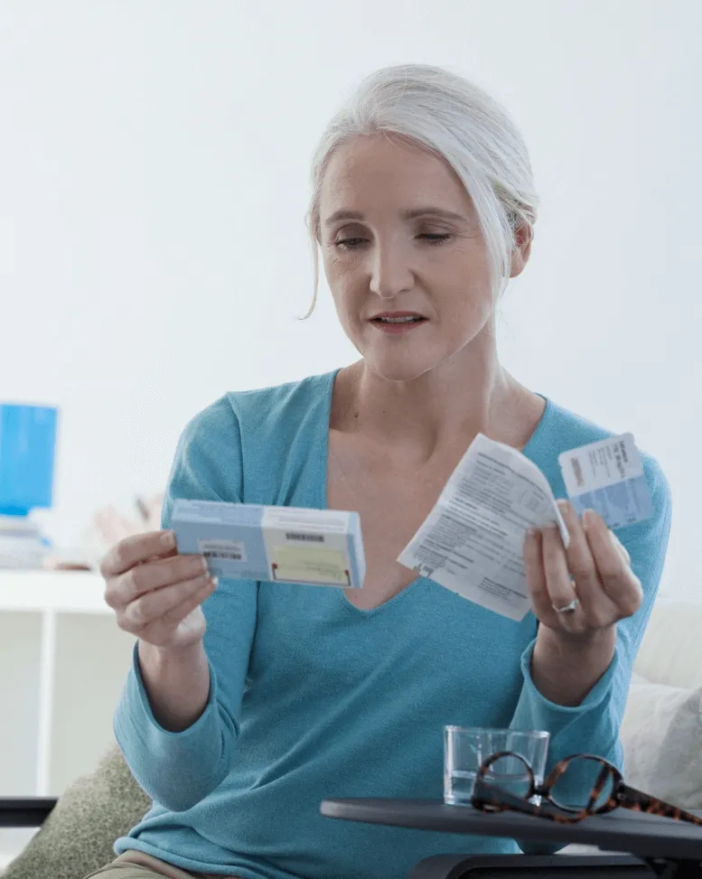 A Sexual Health Expert in Los Angeles examining medication and reading the accompanying prescription information carefully before use.