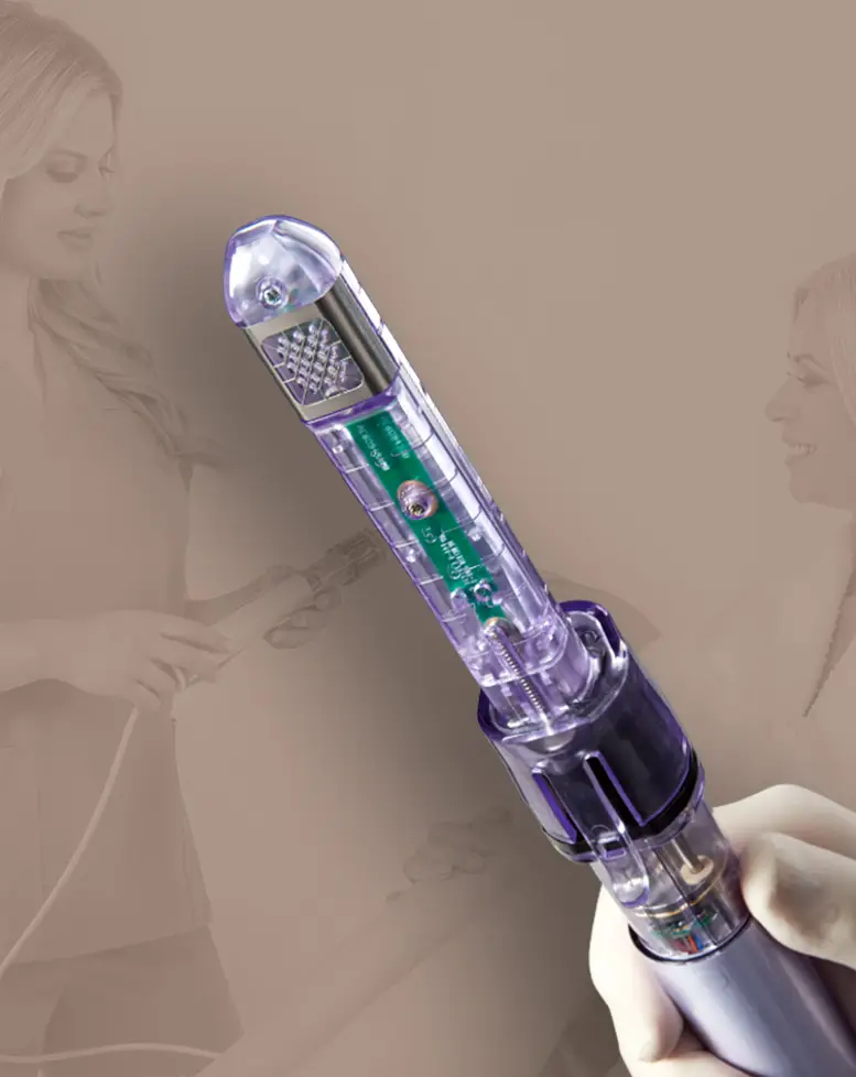 A sleek, futuristic-looking derma roller skin care device is held in focus against a soft, beige background with the blurred reflection of a woman, an expert in sexual health in Los Angeles, using it